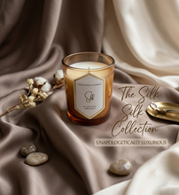 Load image into Gallery viewer, ⁠Selfish Scents Silk 8oz coconut apricot wax candle in warm amber glass jar⁠
